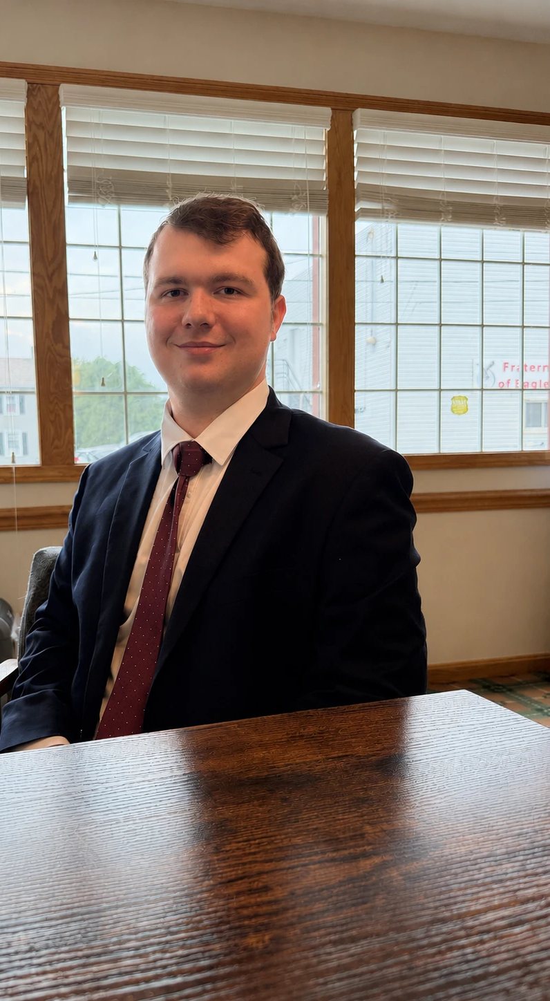 Justin Baker at his desk in the Ask Baker Insurance office in Grove City, Pennsylvania
